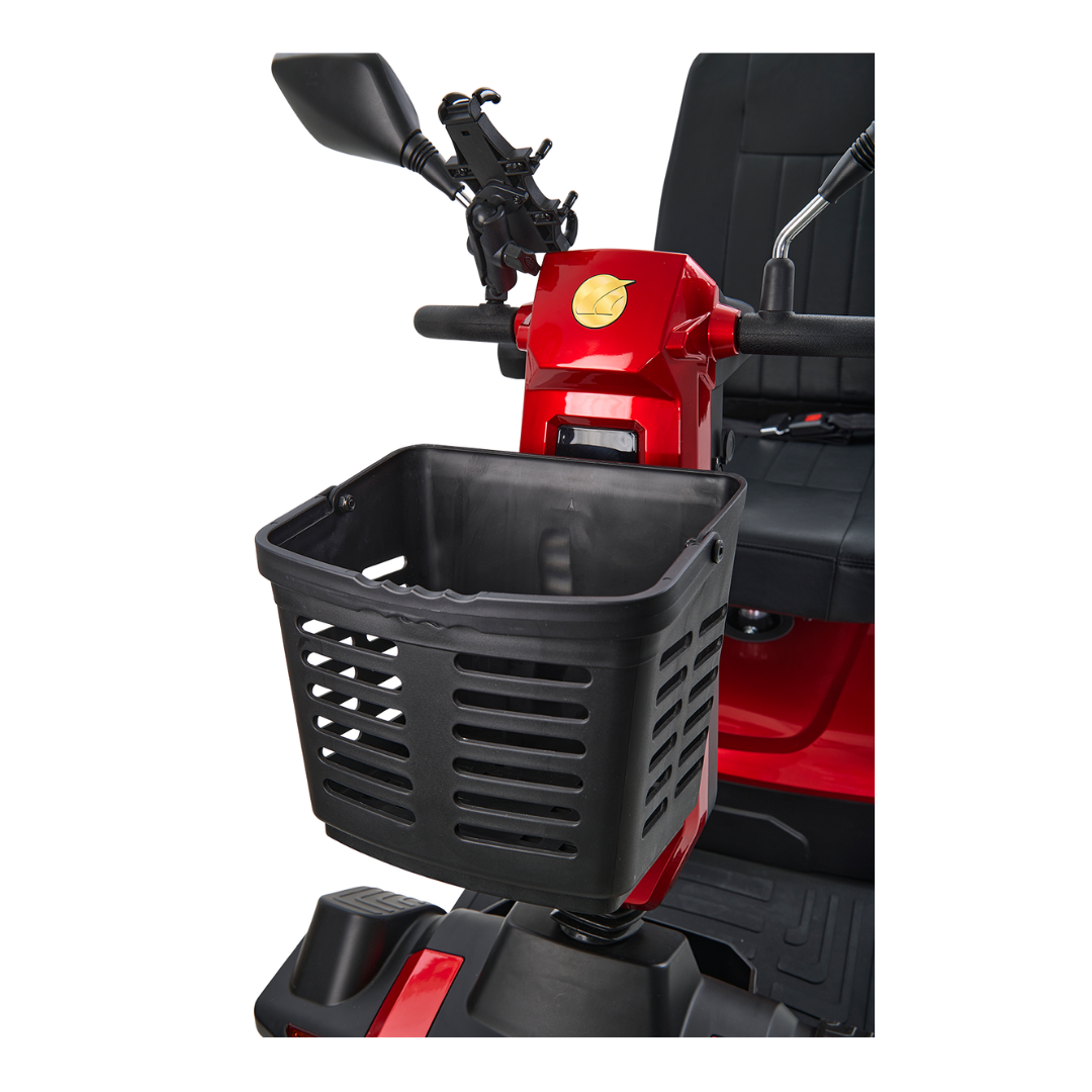 Close-up of a red Golden Tech Eagle HD Bariatric 4-Wheel Scooter with Suspensions front section, showcasing a black slatted basket attached to the handlebars. The scooters sleek seat and rearview mirror are partially visible.