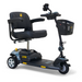 The Golden Tech GB121 Buzzaround XL 3-Wheel Portable Mobility Scooter comes in black with a cushioned seat, handlebar basket, small rear-view mirror, and footrest. It features yellow accents and an extended range battery for longer trips.