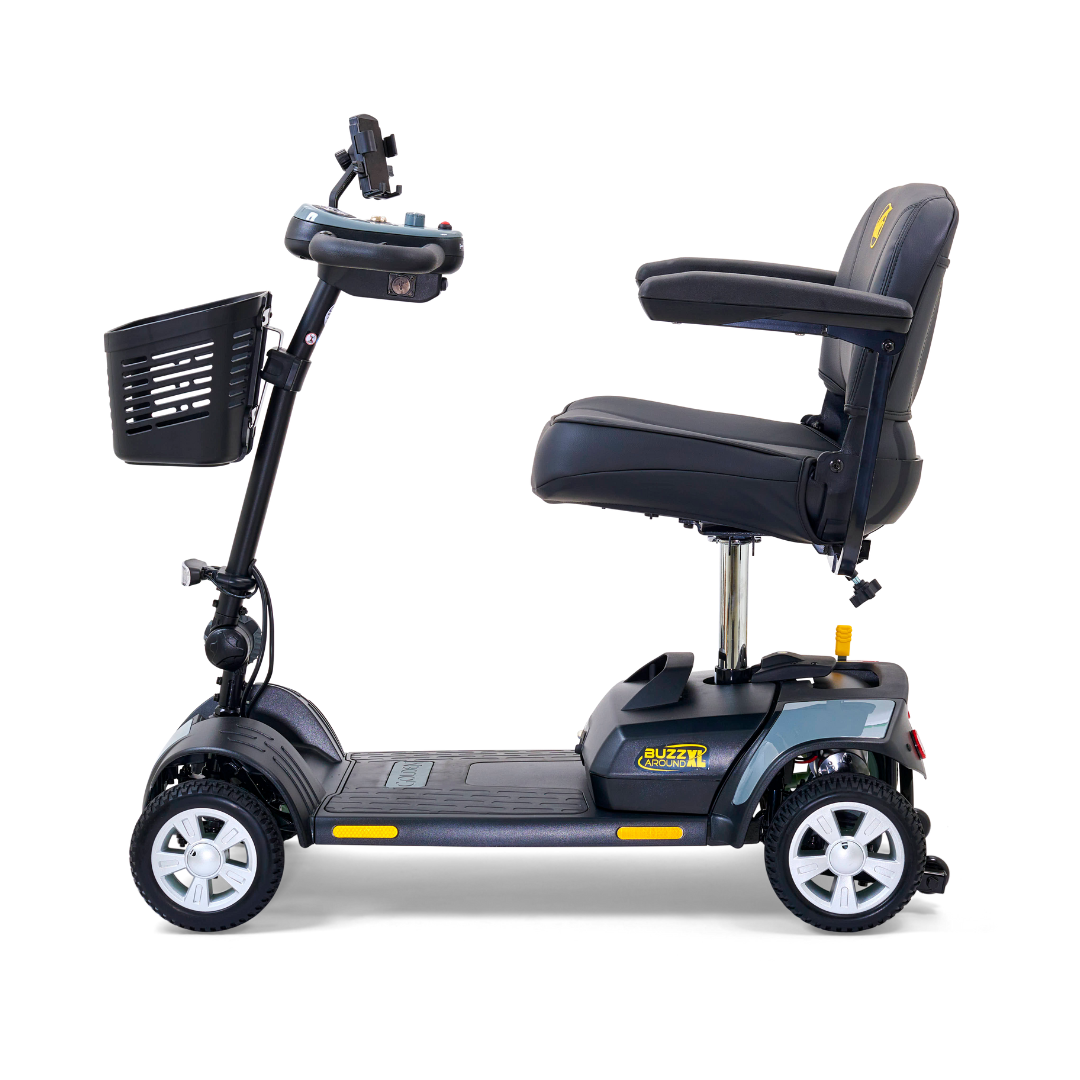 Side view of a Golden Tech GB124 Buzzaround XL 4-Wheel Portable Mobility Scooter, featuring a black design with comfortable seat and armrests, handlebar controls, front basket, improved maneuverability, and wheels with silver accents.