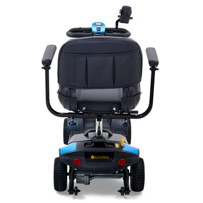 Rear view of a blue Golden Tech GB124 Buzzaround XL 4-Wheel Portable Mobility Scooter with padded black seat, handlebars, and digital display. GOLDEN appears on the back. It has four black wheels for better maneuverability and features a handlebar holder for convenience.