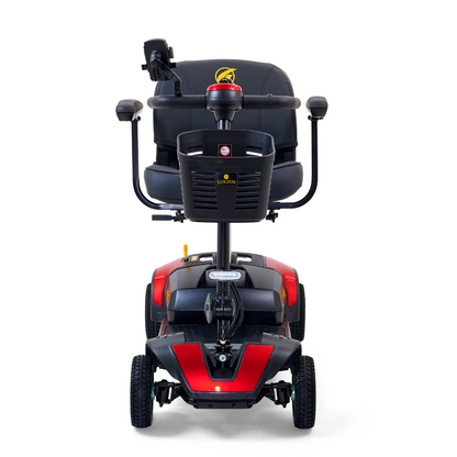 Front view of the Golden Tech GB124 Buzzaround XL 4-Wheel Portable Mobility Scooter in red and black. It has a captains seat, a control panel with handlebars, and offers enhanced maneuverability for easy navigation.