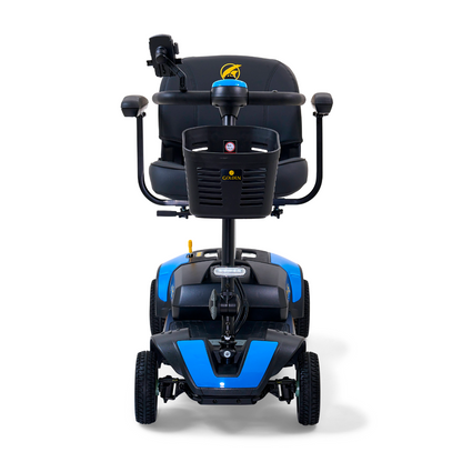 Front view of the Golden Tech GB124 Buzzaround XL, a blue and black 4-wheel portable mobility scooter with padded seat, armrests, and handlebars. The brand logo appears on the backrest and front panel. Designed for improved maneuverability, its ideal for both indoor and outdoor use.