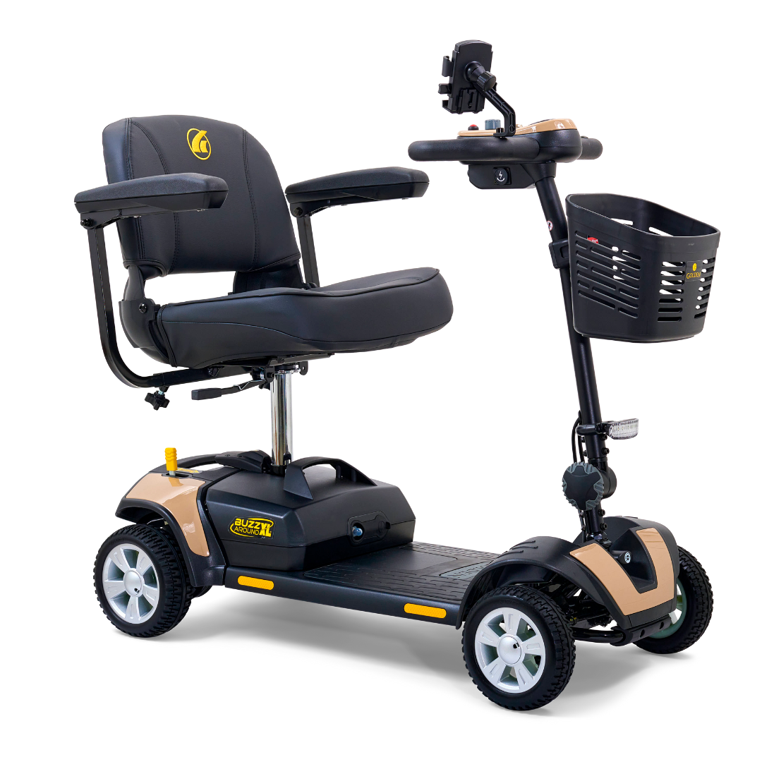 The Golden Tech GB124 Buzzaround XL 4-Wheel Portable Mobility Scooter has a black seat, armrests, and handlebars, with beige and black accents. It features a small front basket for convenience and an LED angle-adjustable headlight for improved visibility, designed for easy transport and accessibility.