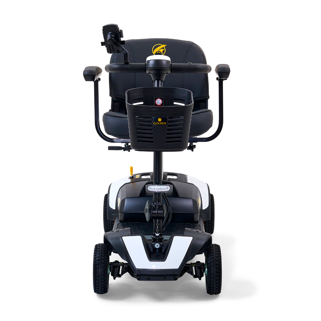 The Golden Tech GB124 Buzzaround XL 4-Wheel Portable Mobility Scooter is shown in black and white, featuring a front basket, comfortable seat with armrests, four robust wheels, extended range battery, and a compact design for enhanced maneuverability.