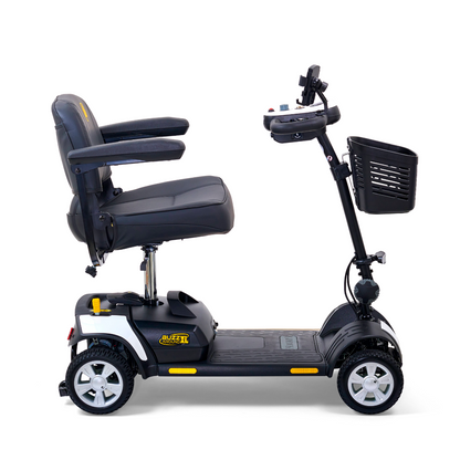 The Golden Tech GB124 Buzzaround XL is a sleek black 4-wheel mobility scooter with a cushioned seat, armrests, and a front basket. It features an extended range battery and tiller-mounted handles and controls for easy maneuvering.