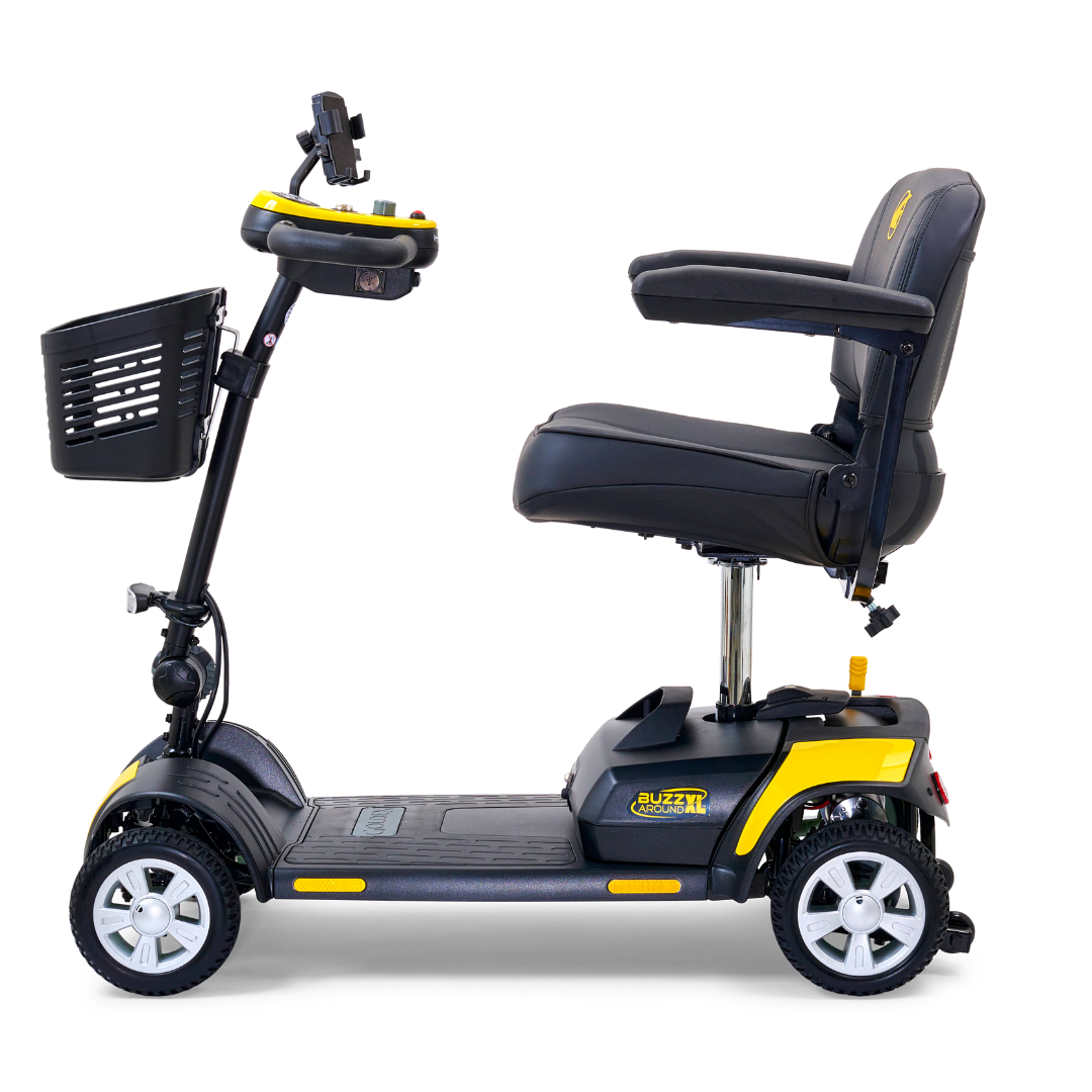 The Golden Tech GB124 Buzzaround XL 4-Wheel Portable Mobility Scooter in black and yellow has a padded seat with armrests, a front basket, and a handlebar control panel. It offers an extended range battery and a low, sturdy base for stability.