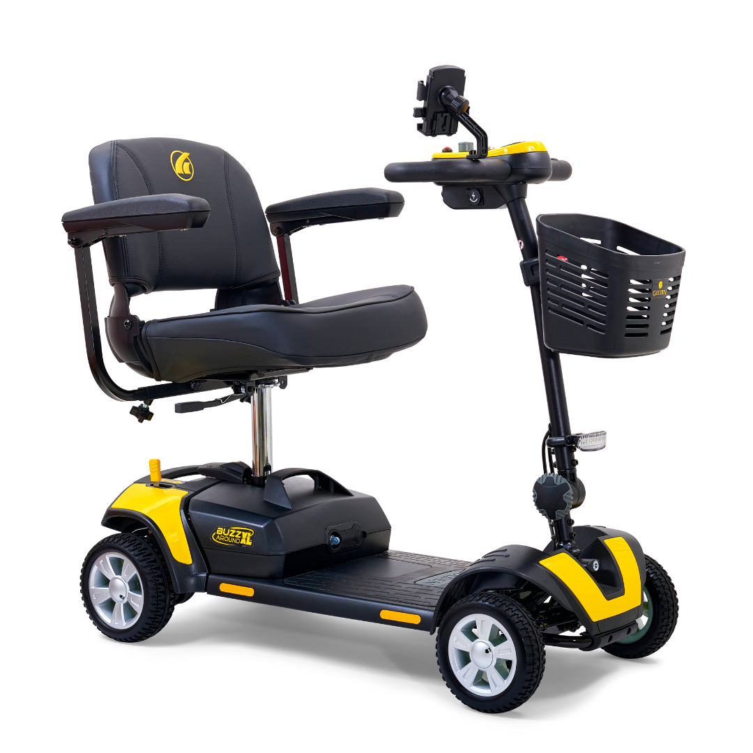 The Golden Tech GB124 Buzzaround XL 4-Wheel Portable Mobility Scooter is a yellow and black wonder, featuring an extended range battery, padded seat with armrests, a front basket, four wheels, and a handlebar for enhanced maneuverability.