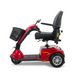 The Golden Tech GC240 Companion Mid-Size Mobility Scooter, in red, features easy disassembly, a comfortable adjustable sliding seat with armrests, a front basket, and three wheels for convenient indoor and outdoor use.