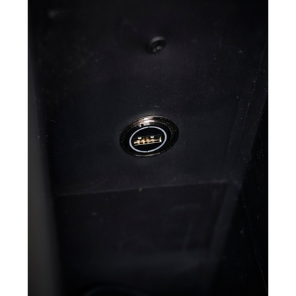 Close-up of a single USB port with gold connectors, embedded in the dark surface of the Golden Tech PR525 Cloud+ Recliner With Lift Assist & Twilight - SM.