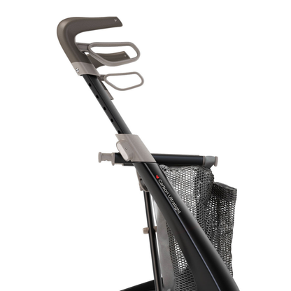 A close-up side view of a black and gray byACRE rollator handle with ergonomic grip, two cup holders, and a mesh bag—perfect for featuring the Grocery Bag For ByAcre Carbon Fiber Rollators as an accessory.