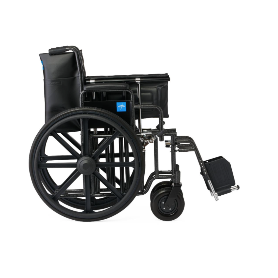 The Medline Guardian Extra-Wide Bariatric Wheelchair, shown from the side against a white background, is black with large rear wheels, smaller front wheels, and footrests. Supports up to 500 lbs for reliable heavy-duty comfort.