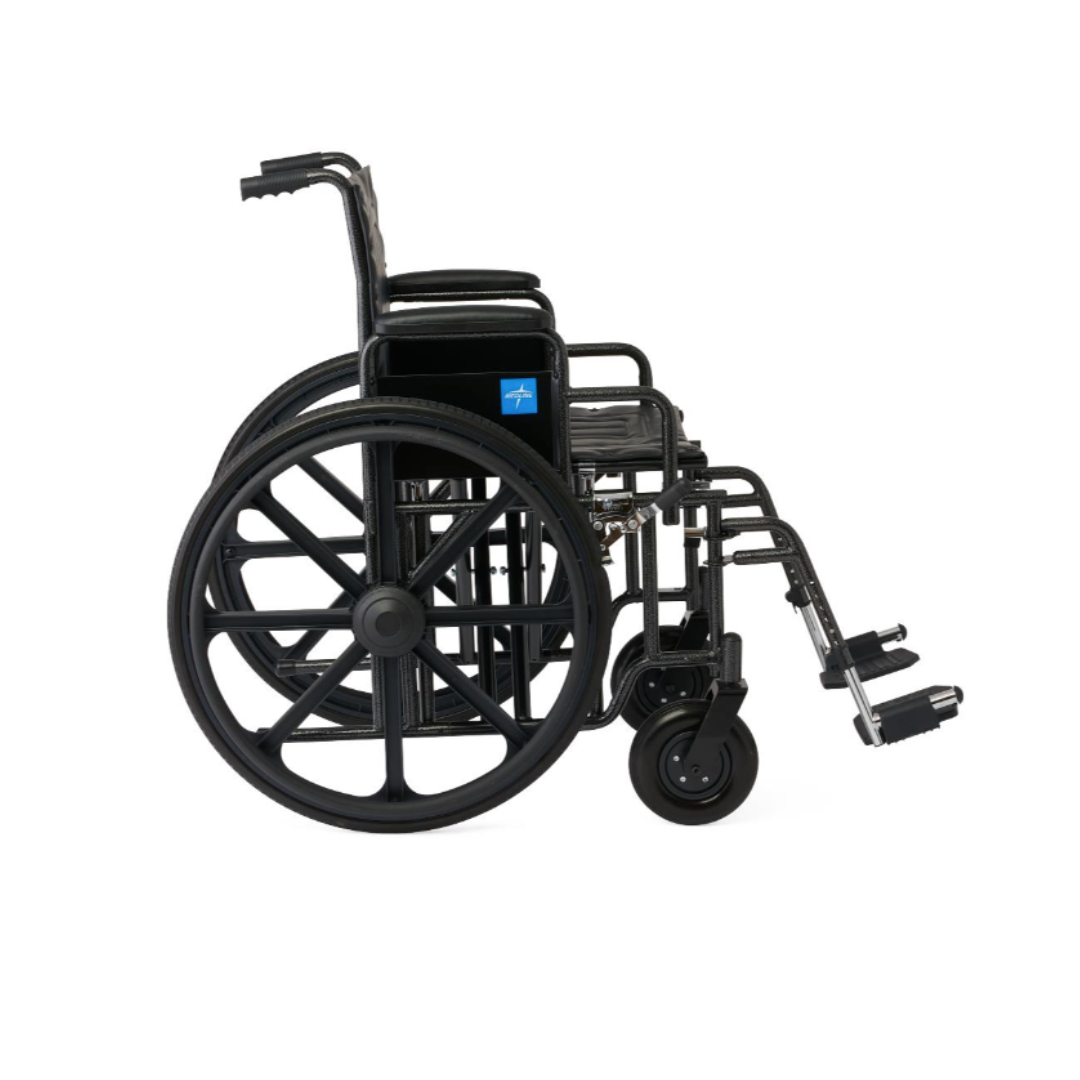 The Medline Guardian Extra-Wide Bariatric Wheelchair, shown in black with large rear wheels, small front wheels, footrests, and armrests, provides heavy-duty support up to 500 lbs and is displayed from the side on a plain white background.