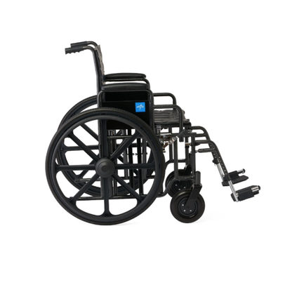 The Medline Guardian Extra-Wide Bariatric Wheelchair, shown in black with large rear wheels, small front wheels, footrests, and armrests, provides heavy-duty support up to 500 lbs and is displayed from the side on a plain white background.