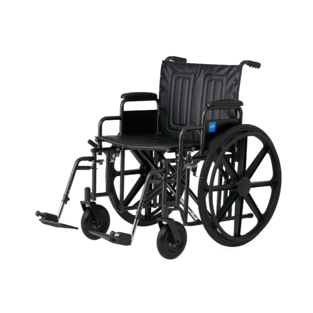The Medline Guardian Extra-Wide Bariatric Wheelchair, shown on a plain white background, is black, manual, features large rear wheels, small front casters, armrests, footrests, and supports up to 500 lbs for heavy-duty use.