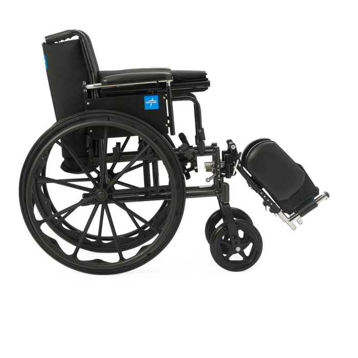 The Medline Lightweight K3 Wheelchair is shown in black with large rear wheels, nylon upholstery, an elevated leg rest extended forward, and a lightweight frame, viewed from the side on a white background.