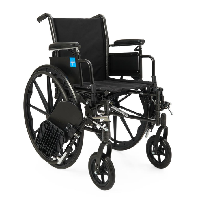 The Medline Lightweight K3 Wheelchair, featuring a black lightweight frame, large rear wheels, small front wheels, padded armrests, footrests, and durable nylon upholstery, is unoccupied and positioned at a slight angle.