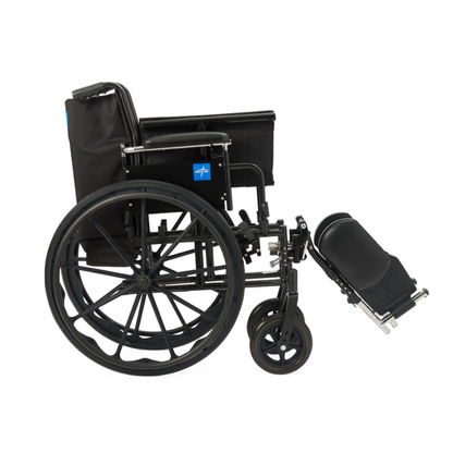 The Medline Lightweight K3 Wheelchair, shown from the side on a white background, features a black folding frame, large rear wheels, elevated leg rests, cushioned seat, and comfortable nylon upholstery.