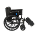 The Medline Lightweight K3 Wheelchair, shown from the side on a white background, features a black folding frame, large rear wheels, elevated leg rests, cushioned seat, and comfortable nylon upholstery.