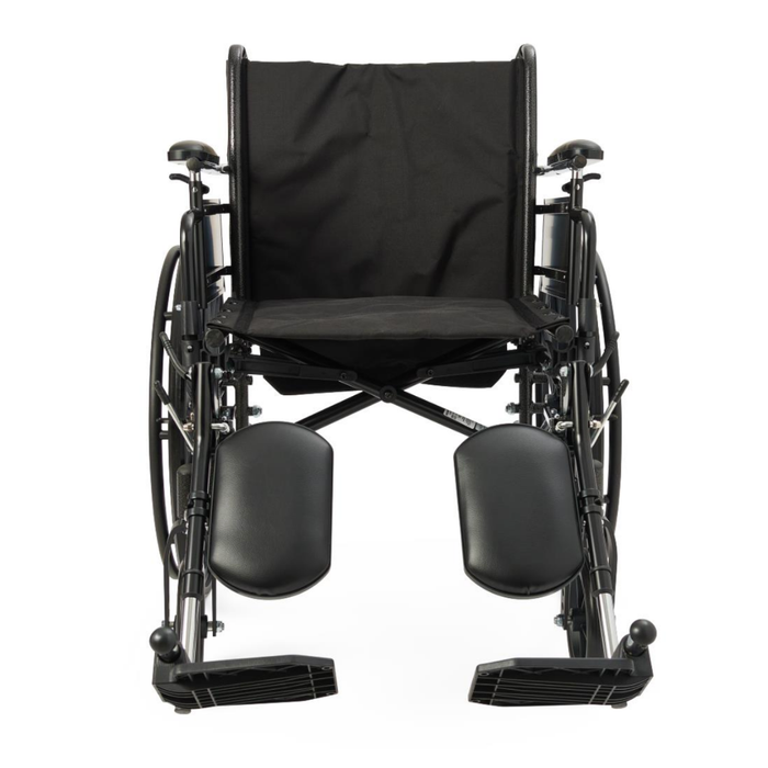 The Medline Lightweight K3 Wheelchair, shown from the front in black, features a lightweight frame, padded leg rests, footplates, armrests, and a large fabric backrest.