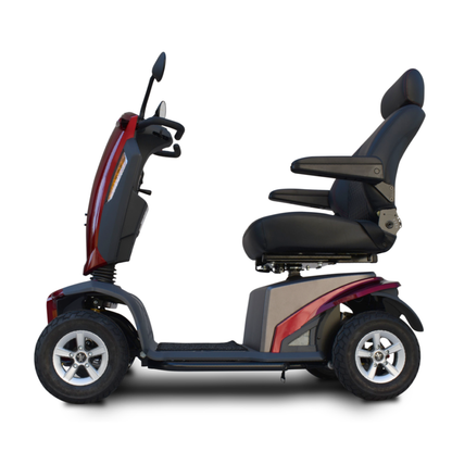 The Heartway VitaExpress Heavy Duty All-Terrain Scooter features four wheels, a cushioned seat with armrests, a high backrest, handlebars, and a sleek red and black frame, shown in side view on a white background.