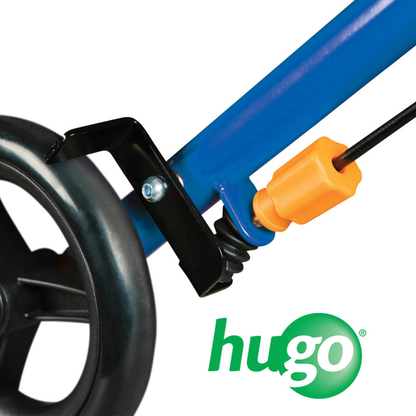 Close-up of a black wheel attached to a blue frame with an orange component and spring, plus the green Hugo logo in the lower right—part of the Drive Hugo Sidekick Side-Folding Rollator.