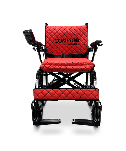 The ComfyGo X-7 Lightweight Foldable Electric Wheelchair, weighing only 40 lbs, features a red quilted design, sleek black frame with logo on the backrest, joystick control on the armrest, and footrests for portability and modern use with powerful motors.
