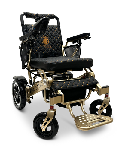 Introducing the MAJESTIC IQ-7000 Auto Folding Remote Controlled Electric Wheelchair: a stylish gold-colored wheelchair featuring an advanced intelligent joystick and elegant black quilted cushioning. It boasts large rear wheels, robust armrests, and proudly displays the Majestic logo on the backrest, effortlessly merging luxury with functionality.