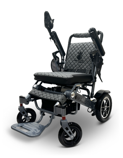 The MAJESTIC IQ-7000 Auto Folding Remote Controlled Electric Wheelchair is a modern black, lightweight mobility aid featuring a quilted seat and backrest, adjustable armrests, a footrest, sturdy wheels, and a 360-degree joystick for seamless control and ultimate comfort.