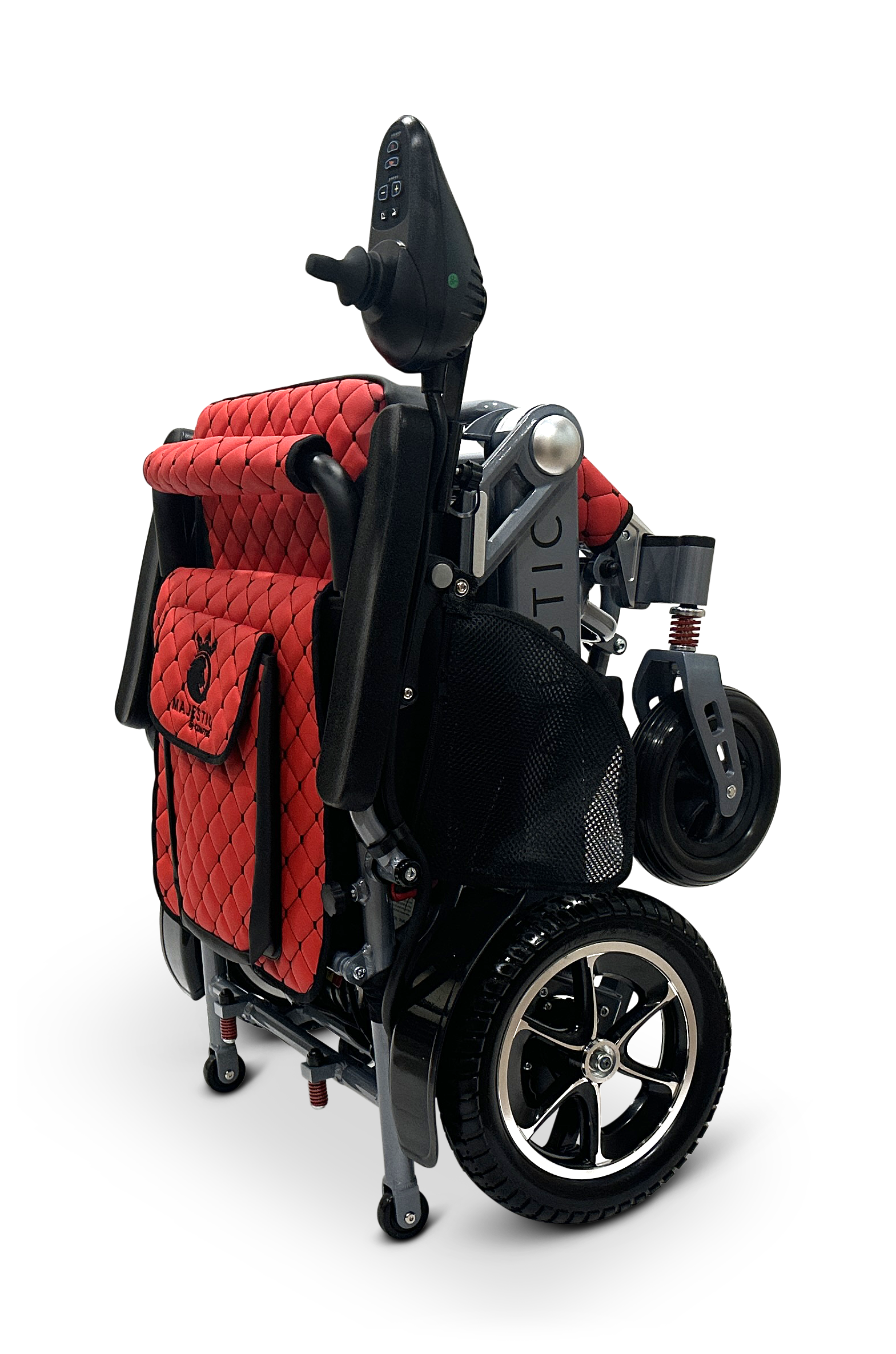 The MAJESTIC IQ-7000 is a compact, auto-folding electric wheelchair in striking red and black with a quilted seat cover. It has a 360-degree joystick on the armrest and sleek metallic wheels that pop against the plain black backdrop, enhancing its elegant design.