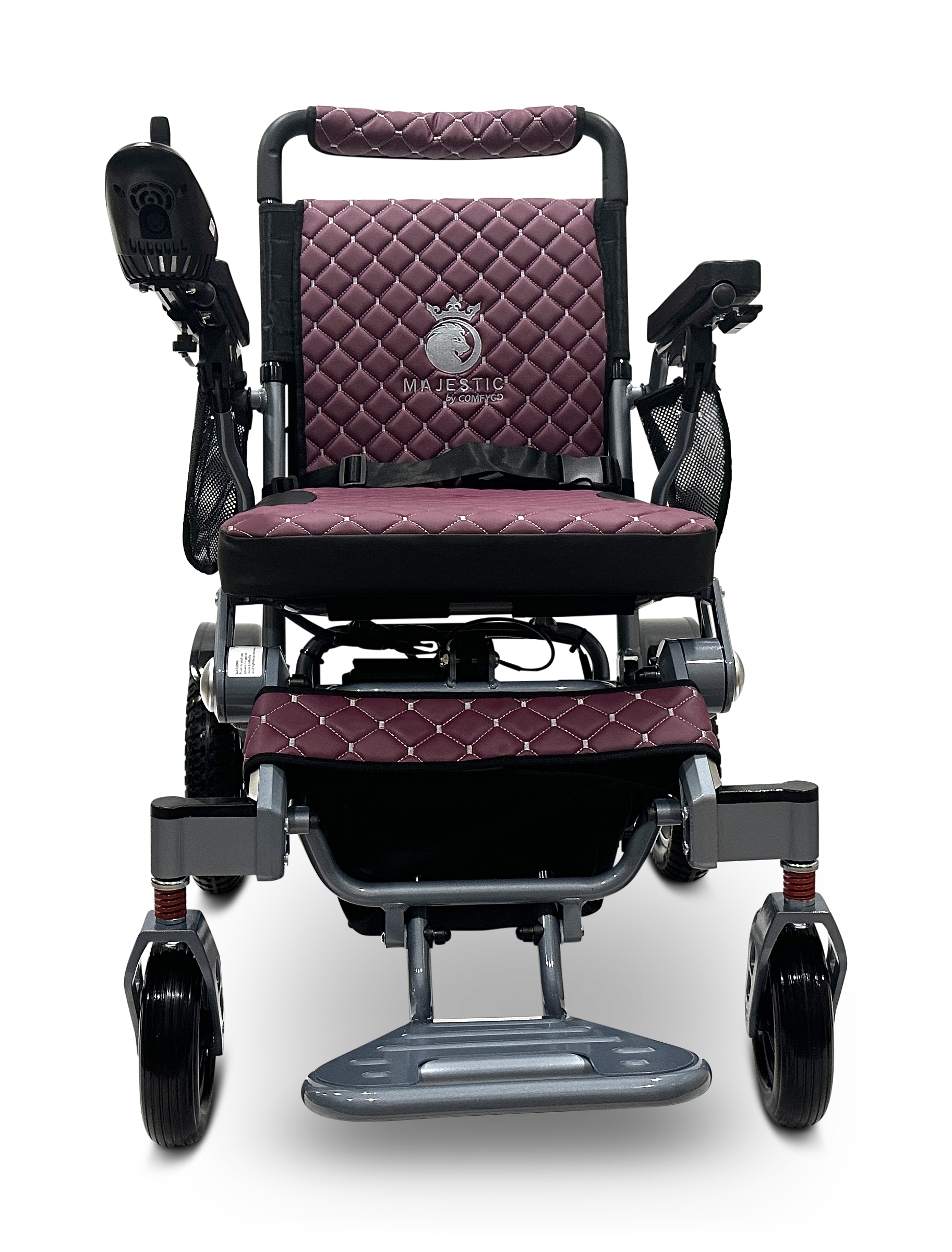 The maroon and black MAJESTIC IQ-7000 electric wheelchair features a quilted seat, backrest for comfort, armrests, 360-degree joystick on the right armrest, Majestic branding on the backrest, and a lightweight metal frame with a visible footrest.