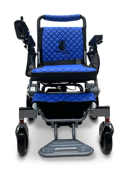 The MAJESTIC IQ-7000 Auto Folding Electric Wheelchair, in blue and black, offers a comfortable cushioned seat with a quilted design, armrests, footrests, and a right-side 360-degree joystick for precise control. Its lightweight and designed for easy maneuverability.