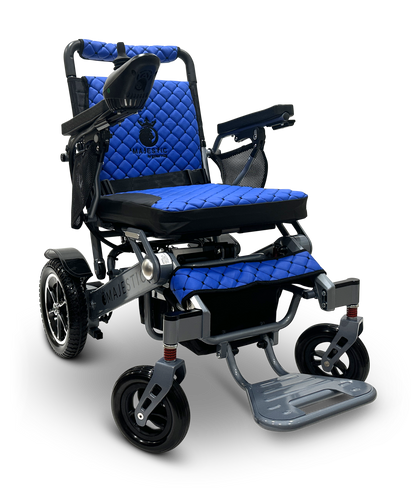 Experience seamless mobility with the MAJESTIC IQ-7000 Remote Controlled Electric Wheelchair, featuring a quilted blue cushion, adjustable armrests, and foldable footrest. It has a sturdy metallic frame, four wheels, and a 360-degree joystick for effortless navigation.