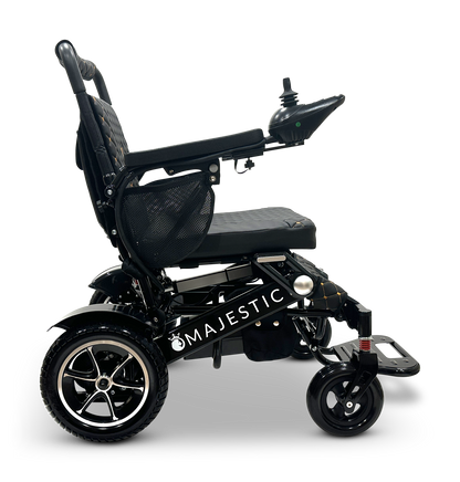 The stylish black MAJESTIC IQ-7000 Remote Controlled Electric Wheelchair features an intelligent joystick located on the armrest for effortless navigation, paired with cushioned seating and robust wheels. This lightweight wheelchair is crafted to offer improved mobility and comfort.