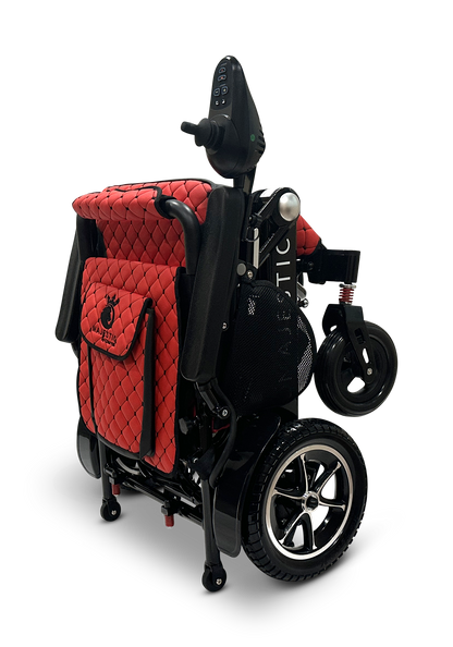 Introducing the MAJESTIC IQ-7000 Remote Controlled Electric Wheelchair: a compact, folding electric wheelchair with a stylish quilted red seat cover and sleek black frame. This lightweight model boasts a joystick controller conveniently located on the right armrest and is equipped with small front wheels for enhanced mobility.
