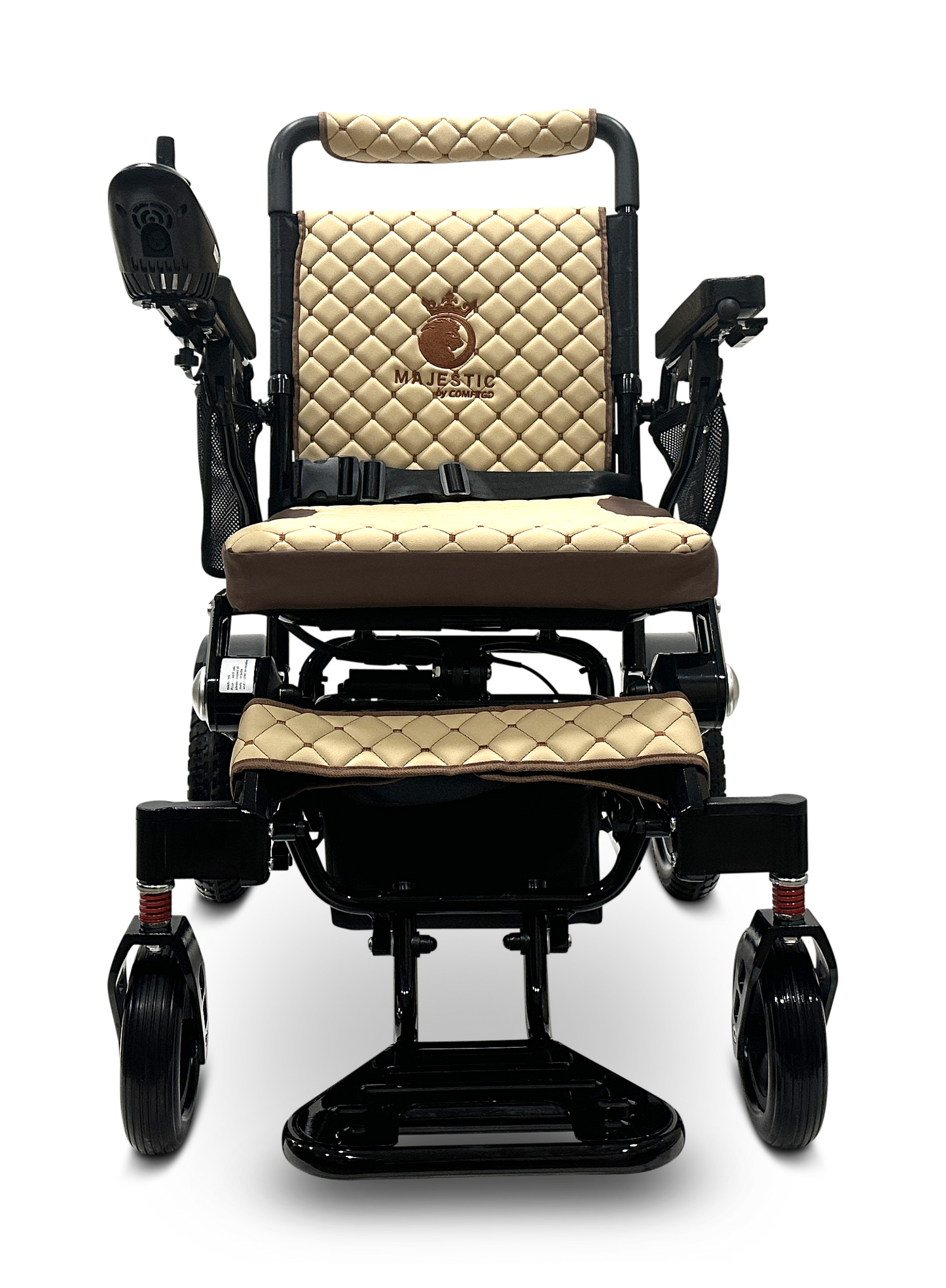 The MAJESTIC IQ-7000 Auto Folding Remote Controlled Electric Wheelchair features a black and tan design with a quilted seat and backrest. It is equipped with an intelligent joystick control on the armrest, rides on four wheels, and elegantly displays the brand name Majestic embroidered on the backrest.