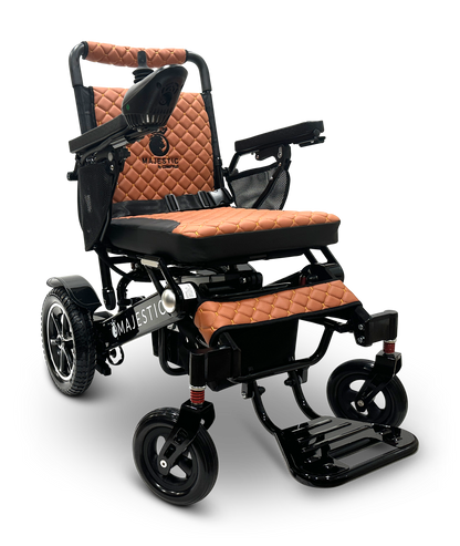 Introducing the MAJESTIC IQ-7000 Remote Controlled Electric Wheelchair, featuring a sleek, modern design with a lightweight black frame and elegant brown quilted upholstery. It boasts large rear wheels, smaller front wheels, comfortable armrests, and an intelligent joystick for effortless navigation. The word "Majestic" is prominently displayed on the front frame.