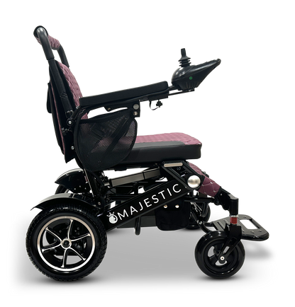 The MAJESTIC IQ-7000 Remote Controlled Electric Wheelchair boasts an intelligent joystick control on the armrest, large rear wheels, and a cushioned seat and backrest, making it ideal for lightweight travel in its sleek black and purple design.