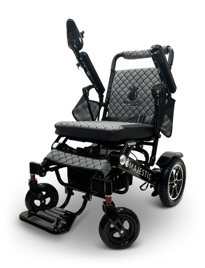 Introducing the MAJESTIC IQ-7000 Remote Controlled Electric Wheelchair: a sleek and lightweight black electric wheelchair featuring quilted padding, raised armrests, and sturdy wheels for enhanced mobility and comfort. The Majestic brand name is prominently displayed on the frame.