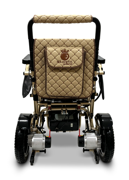 The MAJESTIC IQ-7000 Remote Controlled Electric Wheelchair features a gold and black frame, quilted tan upholstery, and a logo on the backrest. Its sleek, modern design incorporates two discreet motors near the rear wheels, making it an ideal lightweight travel companion.
