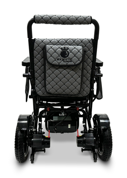 The MAJESTIC IQ-7000 Remote Controlled Electric Wheelchair, designed for travel and viewed from the back, is a lightweight folding model in black and gray, featuring a quilted backrest, rear storage pocket, and large wheels.