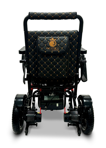 Rear view of the MAJESTIC IQ-7000 Remote Controlled Electric Wheelchair, showcasing its stylish black design, quilted leather upholstery, and embroidered logo. This lightweight wheelchair includes robust wheels, a metal frame, an auto-folding feature, and an intelligent joystick for unparalleled control.