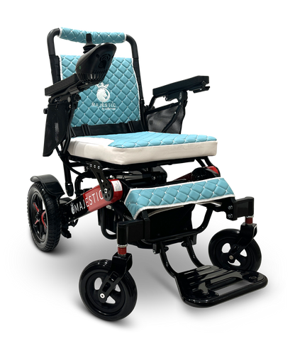 The MAJESTIC IQ-7000 Remote Controlled Electric Wheelchair is a lightweight model in blue and black, featuring a quilted backrest and seat. It comes equipped with sturdy wheels, a joystick control located on the armrest, and prominently displays the brand name Majestic on its frame.