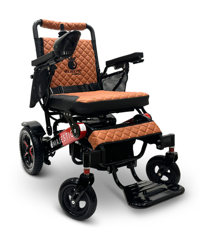 Introducing the MAJESTIC IQ-7000 Remote Controlled Electric Wheelchair, designed with a stylish black frame and elegant quilted brown seat and backrest. It features an auto-folding design for convenience, along with thick armrests and a joystick control located on the right arm. Enjoy enhanced comfort and mobility with its four sturdy wheels.