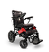 The ComfyGo MAJESTIC IQ-9000 Remote Controlled Electric Wheelchair, featuring a red and black color scheme with cushioned seats, is equipped with brushless silent motors and a digital joystick controller. Its design includes large rear wheels for stability, smaller front wheels for maneuverability, and displays the Majestic name on the frame.