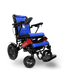 The ComfyGo MAJESTIC IQ-9000 Remote Controlled Electric Wheelchair is a blue and black model with a quilted design. It includes armrests, large rear wheels, smaller front wheels, a footrest, and a joystick controller on the right armrest. The Majestic brand name is prominently displayed on the backrest and base.