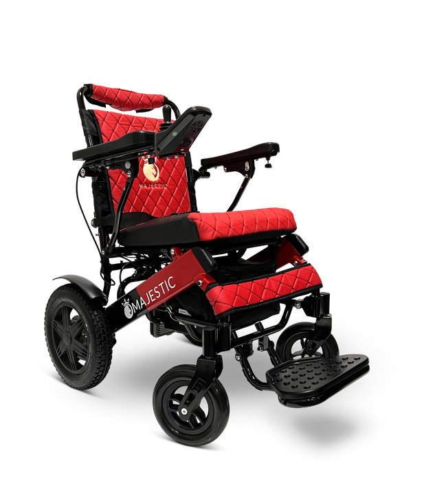 The ComfyGo MAJESTIC IQ-9000 Remote Controlled Electric Wheelchair boasts a striking red and black color scheme with a quilted seat design. It comes equipped with a digital joystick controller for ease of use. The large rear wheels and smaller front wheels, coupled with brushless silent motors, ensure smooth mobility. Additionally, the wheelchair features foldable armrests and a footrest, with the word "Majestic" elegantly printed on the side.