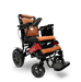 Introducing the ComfyGo MAJESTIC IQ-9000, a luxurious electric wheelchair that combines style and functionality. It features quilted brown cushions, a digital joystick controller on the right armrest, and a sleek black and red frame. Equipped with brushless silent motors for smooth operation, large rear wheels, a convenient footrest, and an attached storage compartment at the back.