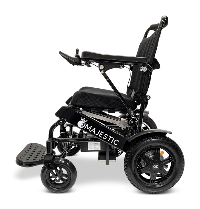 The ComfyGo MAJESTIC IQ-9000 Auto Folding Electric Wheelchair features a sleek black design, equipped with brushless silent motors, a cushioned seat, adjustable armrests, and large rear wheels for enhanced comfort. Its advanced digital joystick controller ensures precise navigation.