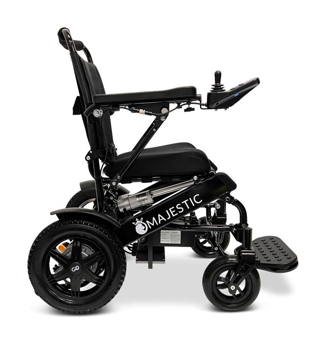 Side view of a black ComfyGo MAJESTIC IQ-9000 Auto Folding Electric Wheelchair with the brand name Majestic on the frame. It includes an IQ-9000 AR digital joystick controller, sturdy wheels, a brushless silent motor, and an adjustable backrest, all designed for enhanced mobility and comfort.