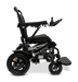 Side view of a black ComfyGo MAJESTIC IQ-9000 Auto Folding Electric Wheelchair with the brand name Majestic on the frame. It includes an IQ-9000 AR digital joystick controller, sturdy wheels, a brushless silent motor, and an adjustable backrest, all designed for enhanced mobility and comfort.